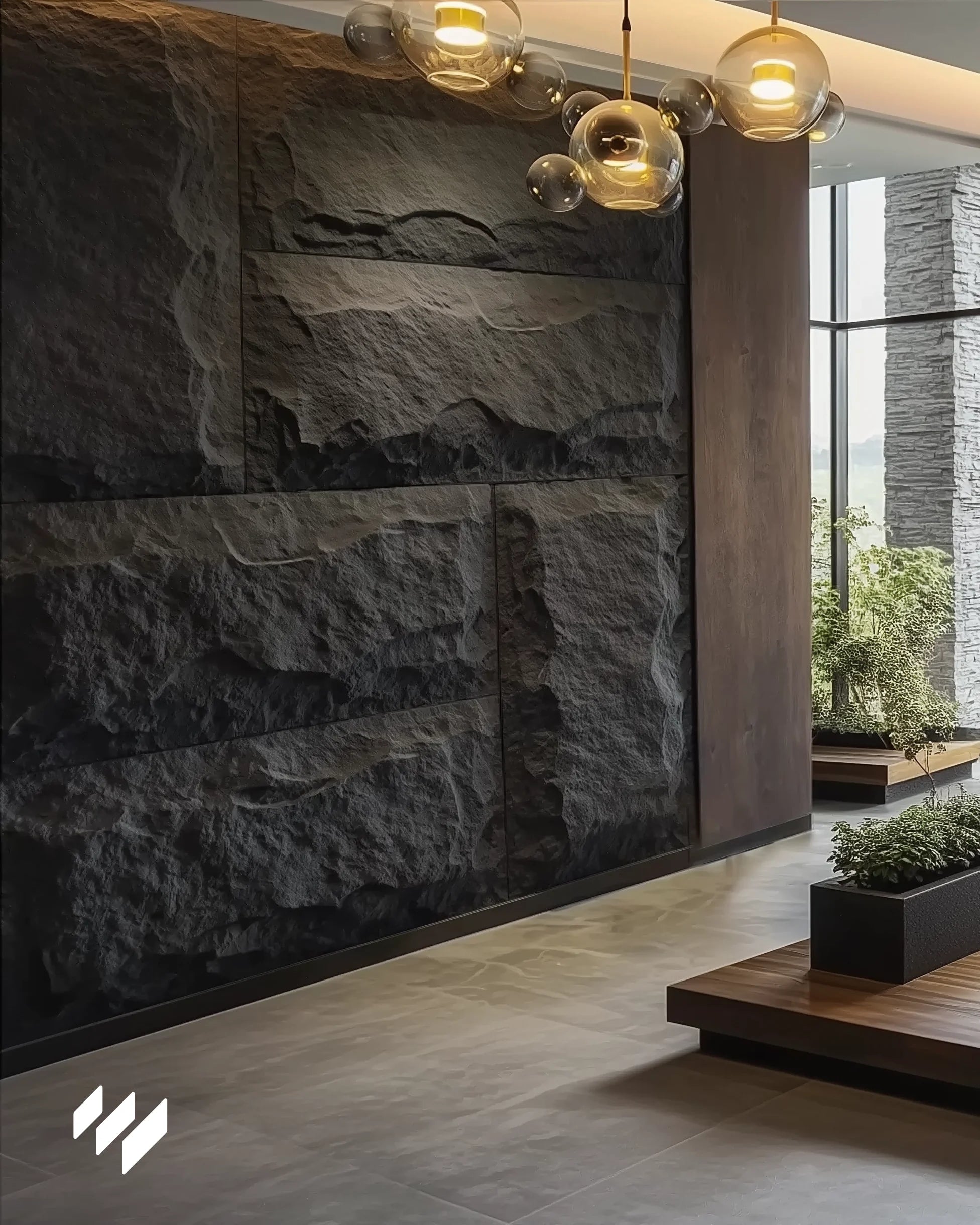 Entrada contemporánea decorada con paneles PU efecto piedra Negro Basalto de Revestimientos Pared, iluminada con lámparas colgantes de diseño.