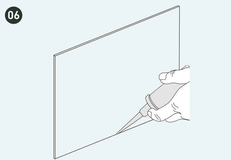 Ilustración de la aplicación de adhesivo impermeable entre el panel y el suelo, y la instalación de accesorios finales.