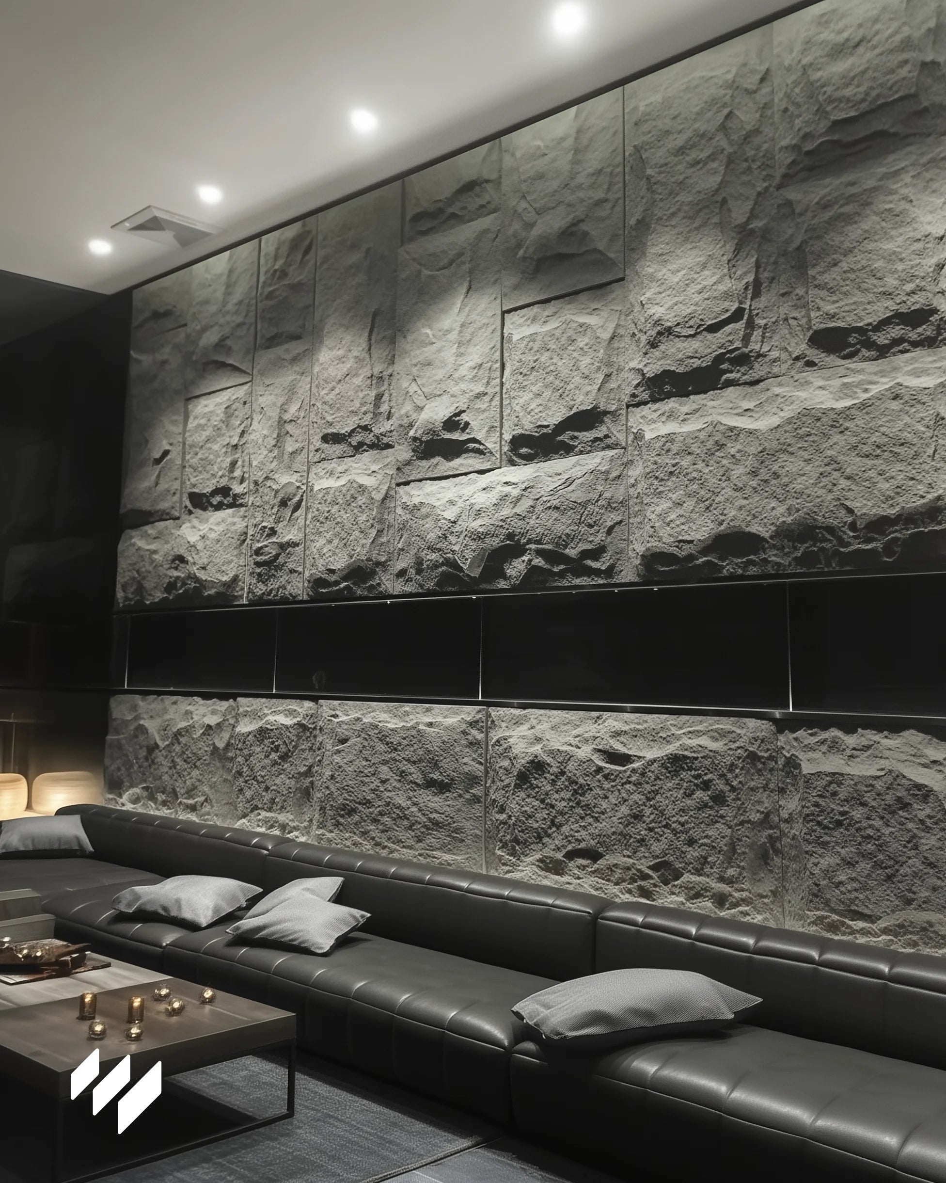 Espacio residencial con revestimiento PU efecto piedra Negro Basalto de Revestimientos Pared, destacando la textura natural bajo luz ambiental LED.