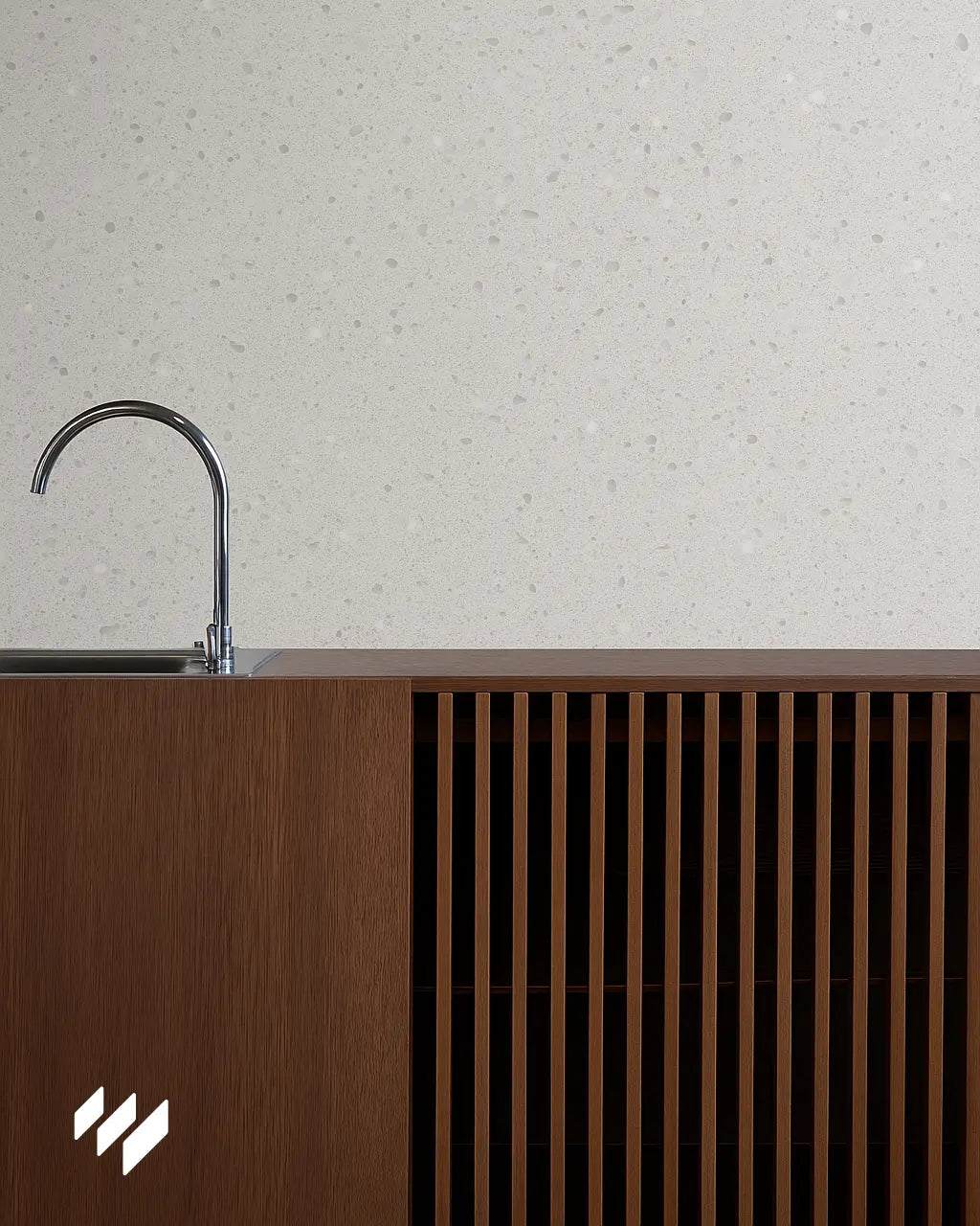 Encimera de cocina o lavadero con pared revestida de panel SPC efecto terrazo y mueble de madera moderna.