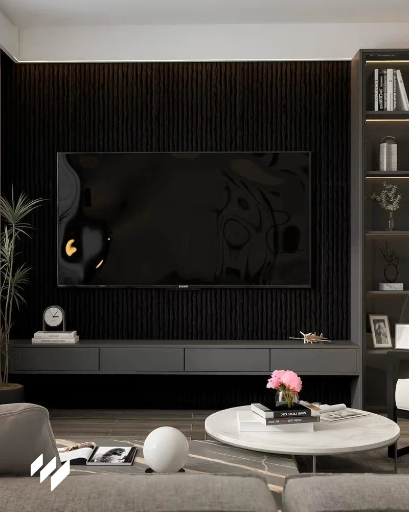 Pared de televisión con Revestimiento de pared efecto piedra acanalada negro de Revestimientos Pared, creando un diseño moderno y elegante en la sala de estar.