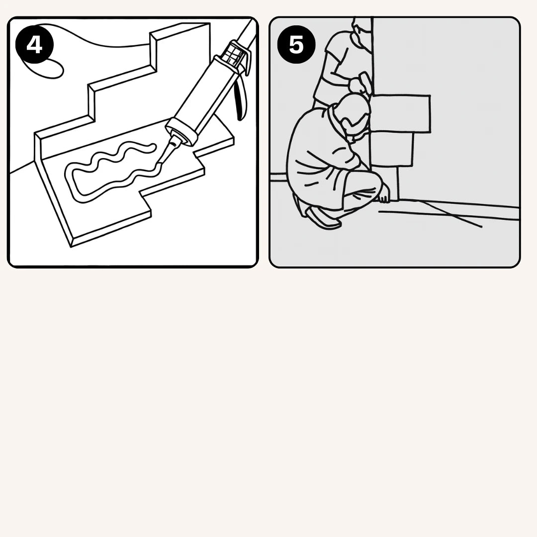 Aplicación de adhesivo en el reverso de un panel de esquina y fijación de las primeras piezas sobre la línea de referencia inferior.